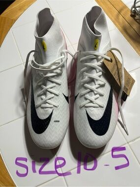 Nike White High-Top Soccer Cleats with Black Swoosh and Pink Accents